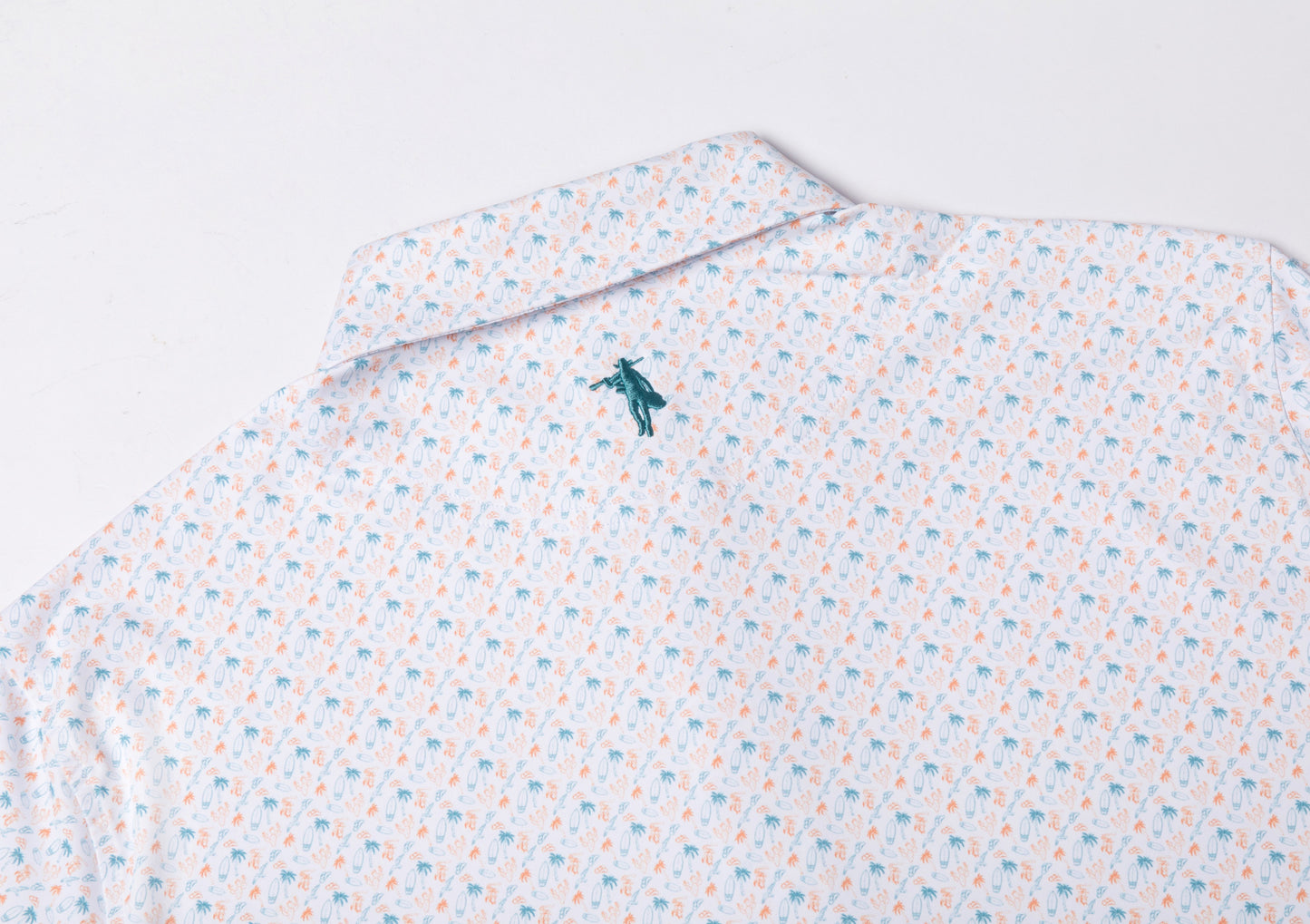 Patterned shirt with a small logo on a light gray background