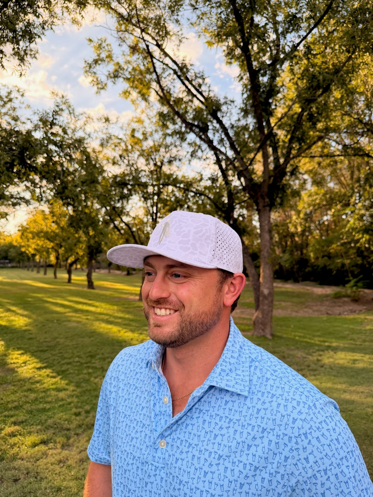 White Camo trucker cap with embroidered logo by Thomas Adams Apparel