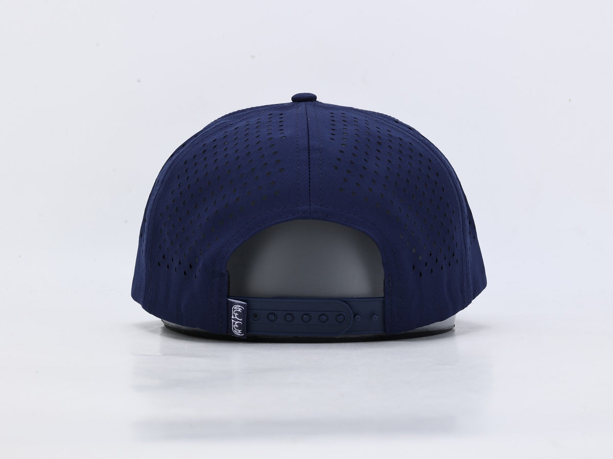 The back view of a navy blue baseball cap with a perforated fabric crown and an adjustable snapback strap, shown on a white background.