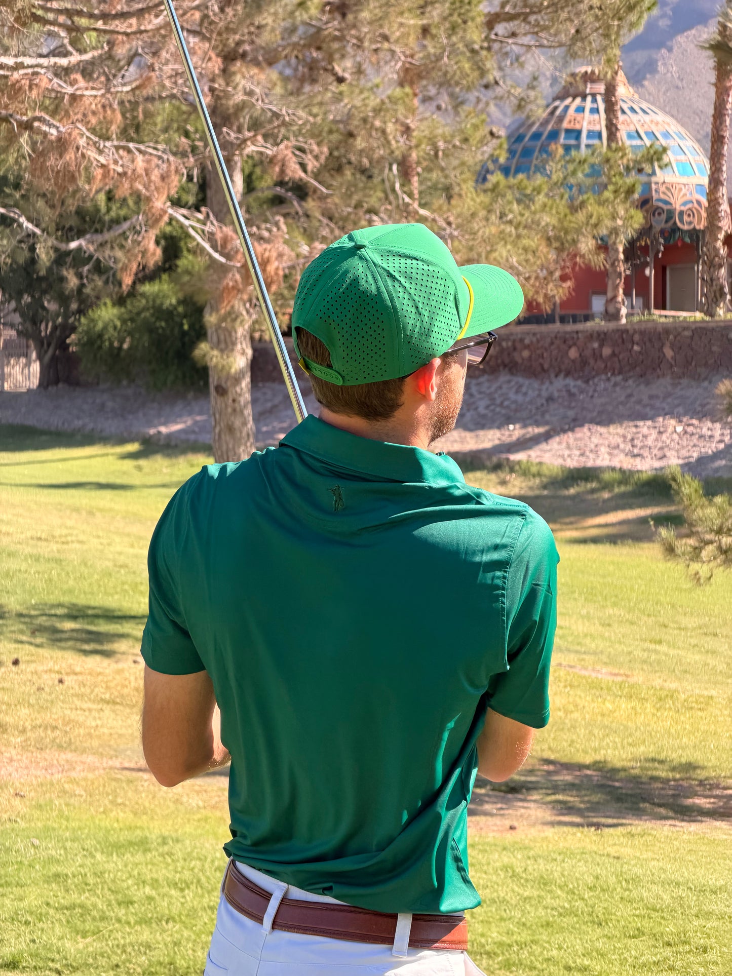 Men's green performance polo shirt by Thomas Adams Apparel