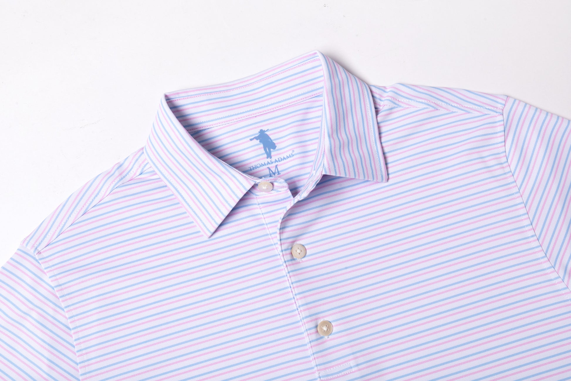 Striped polo shirt with a brand logo on a light background