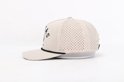 Beige baseball cap with perforated design on a white background