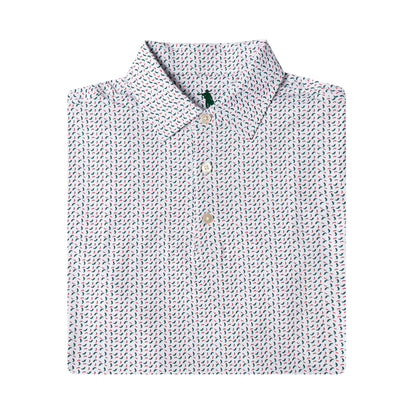 A folded long-sleeve button-up shirt with a white base and a dense, small-scale multicolor pattern of blue, green, and red motifs, shown on a plain white background.