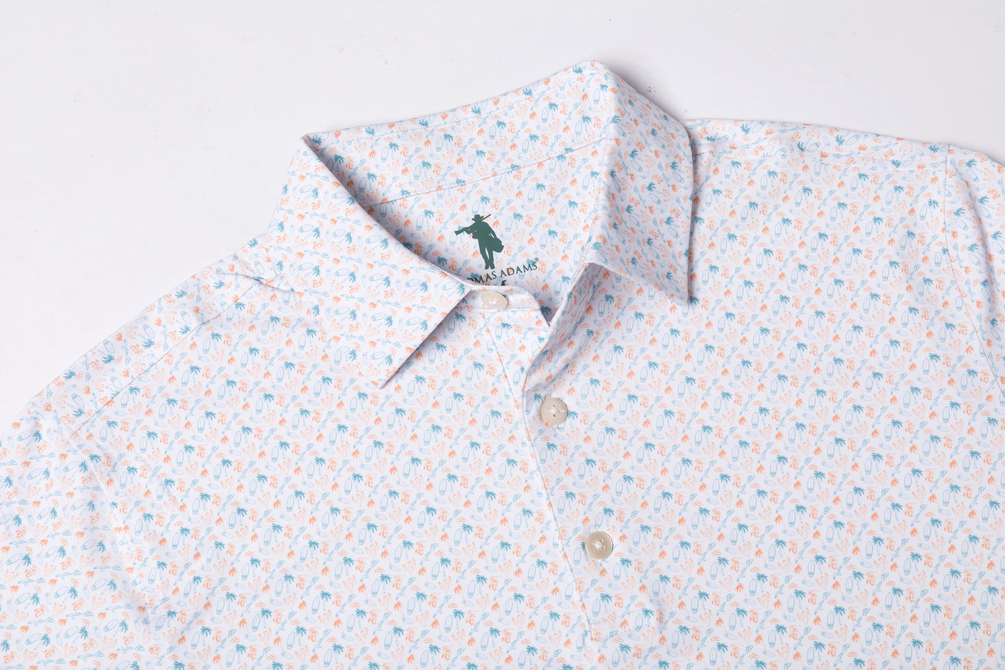 Patterned polo shirt with a brand logo on a light background