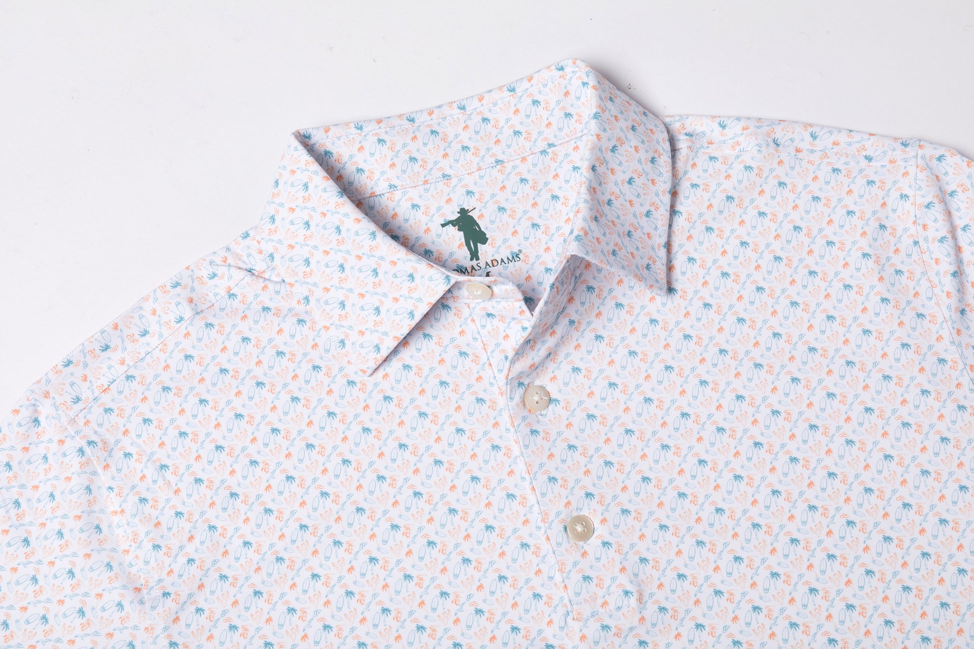 Patterned polo shirt with a brand logo on a light background