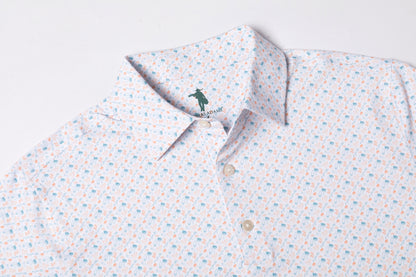 Patterned polo shirt with a brand logo on a light background