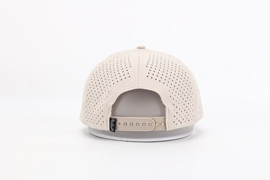 Beige baseball cap with perforated design on a white background