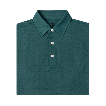 A folded dark teal polo shirt with a subtle micro-pattern, featuring a three-button placket and classic collar, shown on a solid white background.