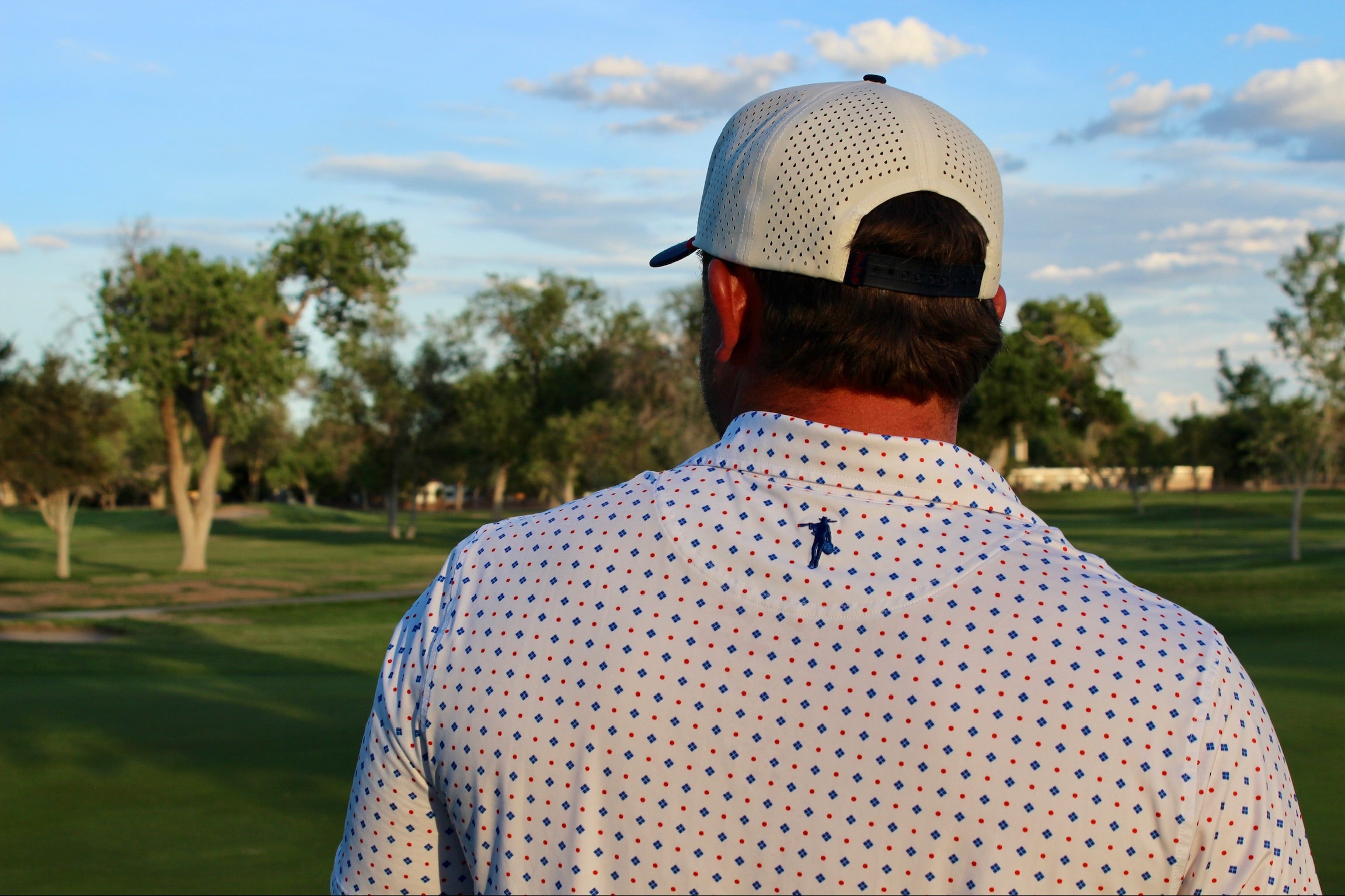 Men's white geometric performance polo shirt by Thomas Adams Apparel