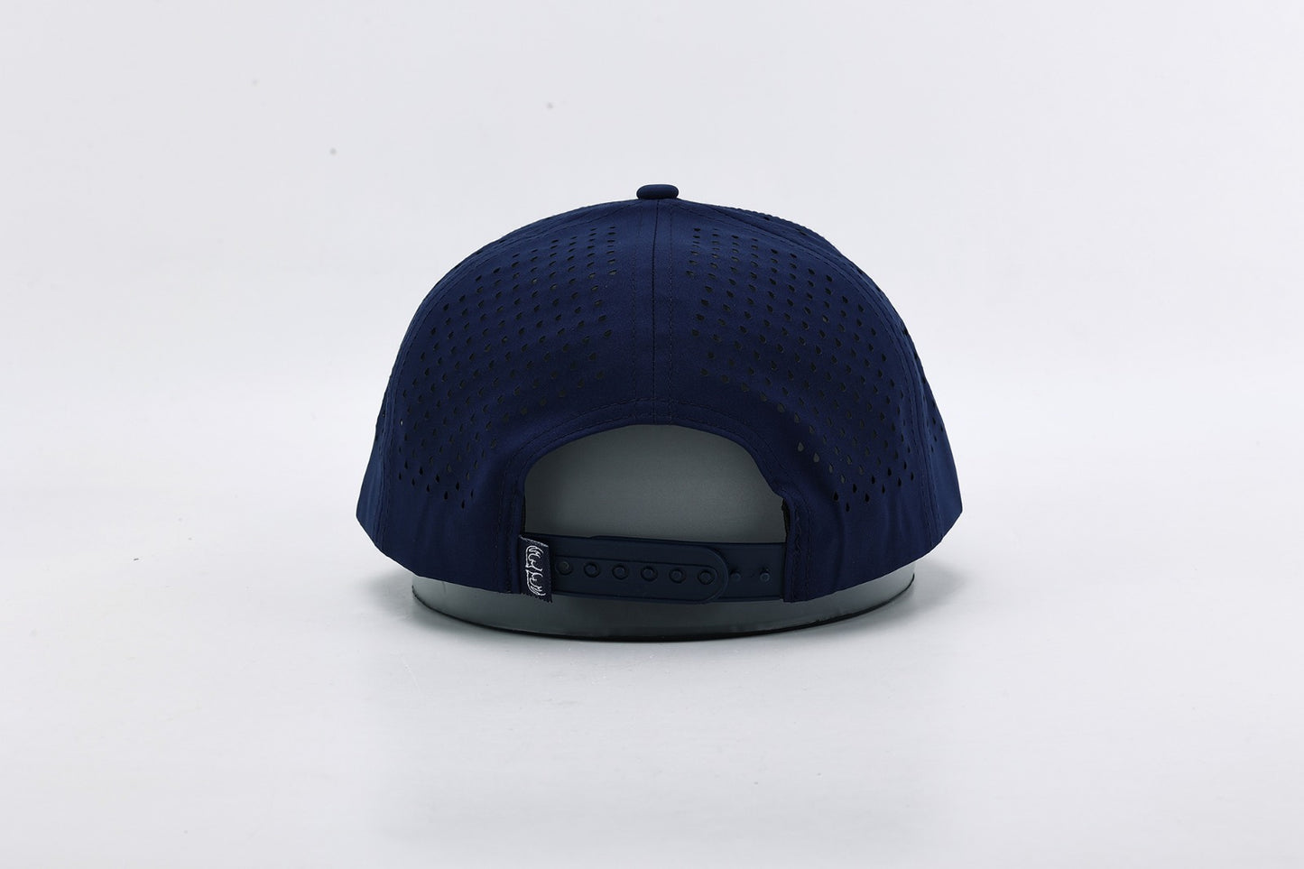 Navy blue cap on a light gray background