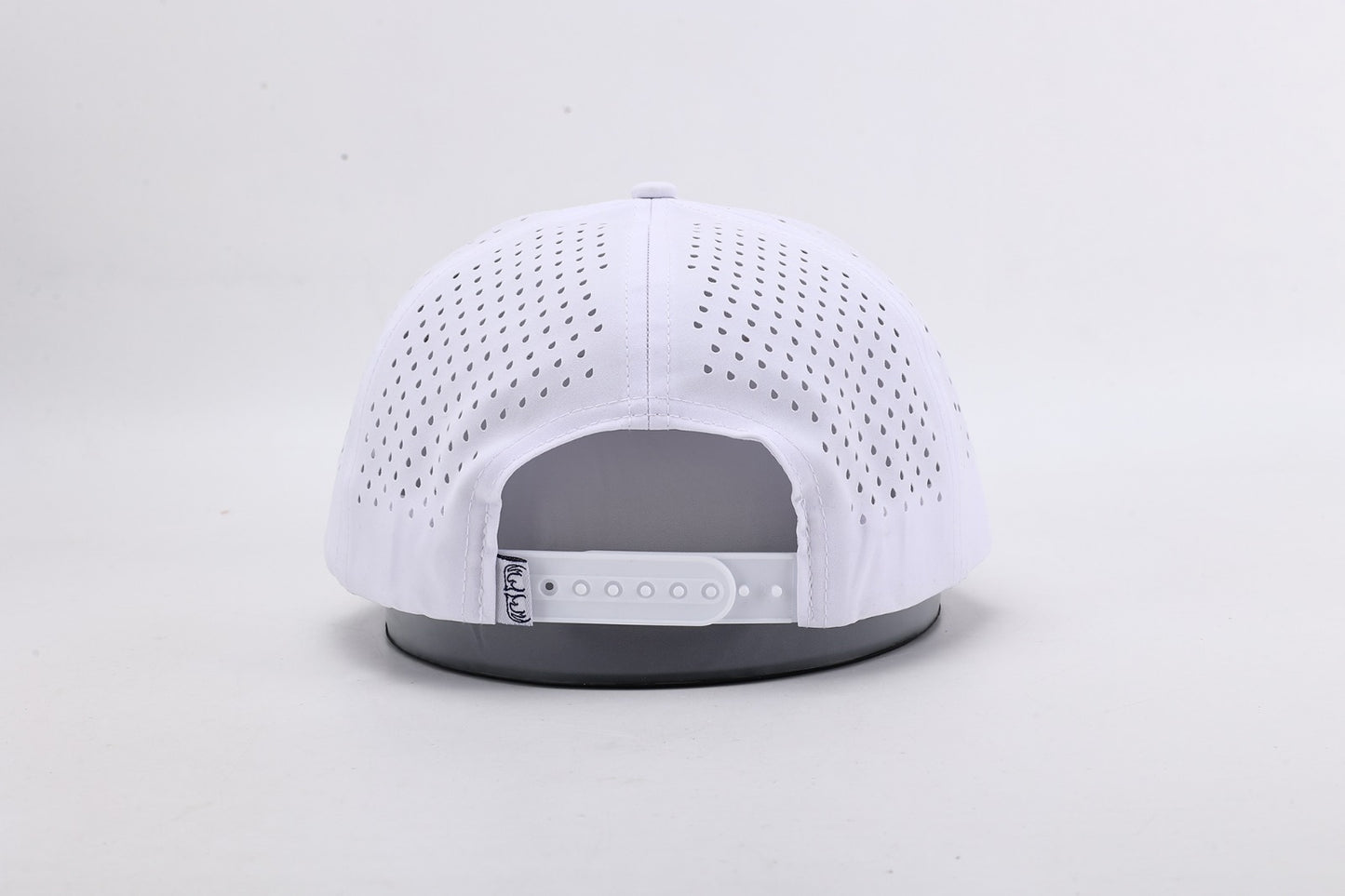 White baseball cap with gray brim on a light gray background