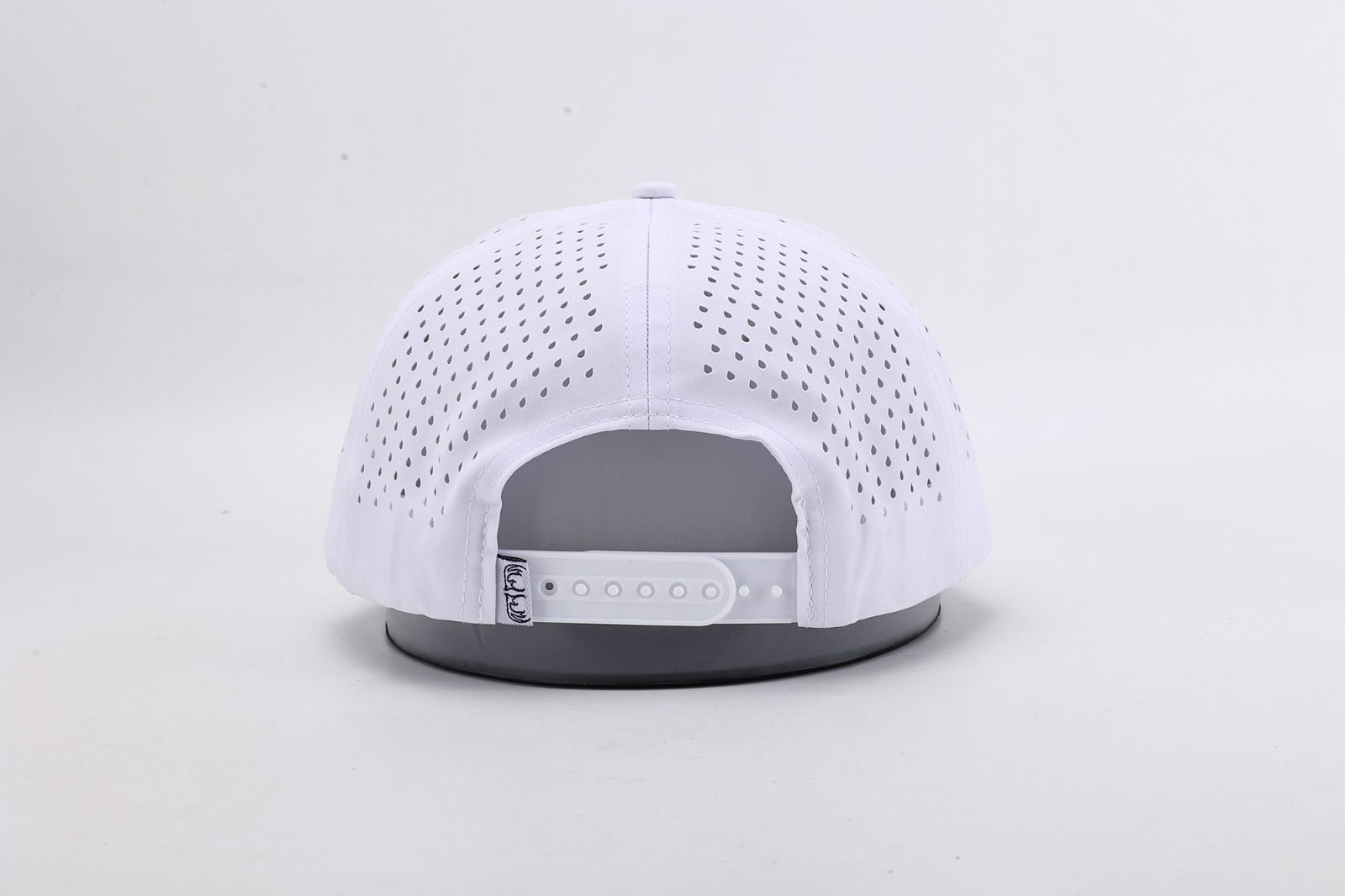 White baseball cap with gray brim on a light gray background