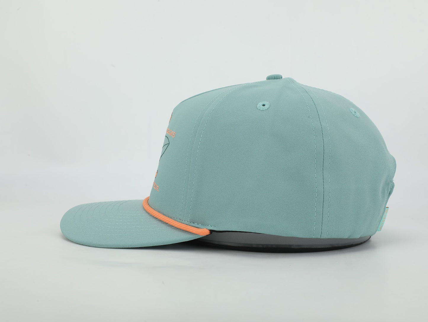 Teal baseball cap with orange brim on a light gray background