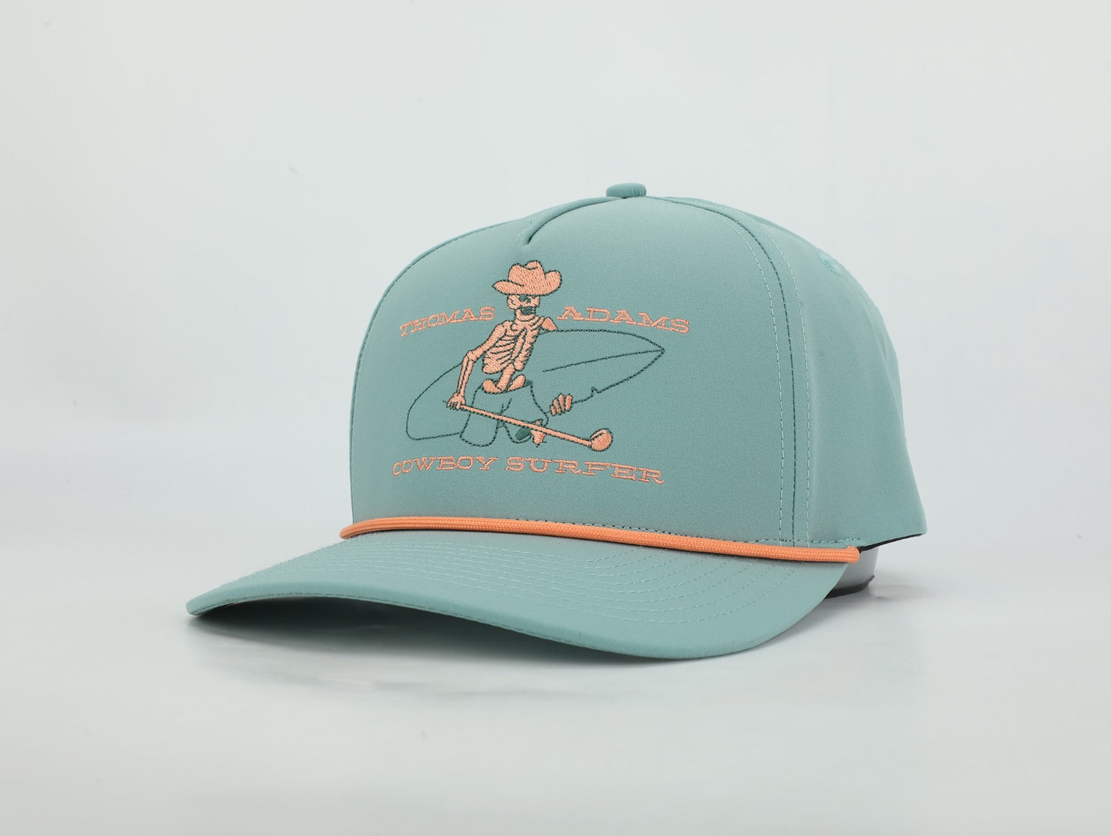 Light blue cap with skeleton design and text on a light gray background