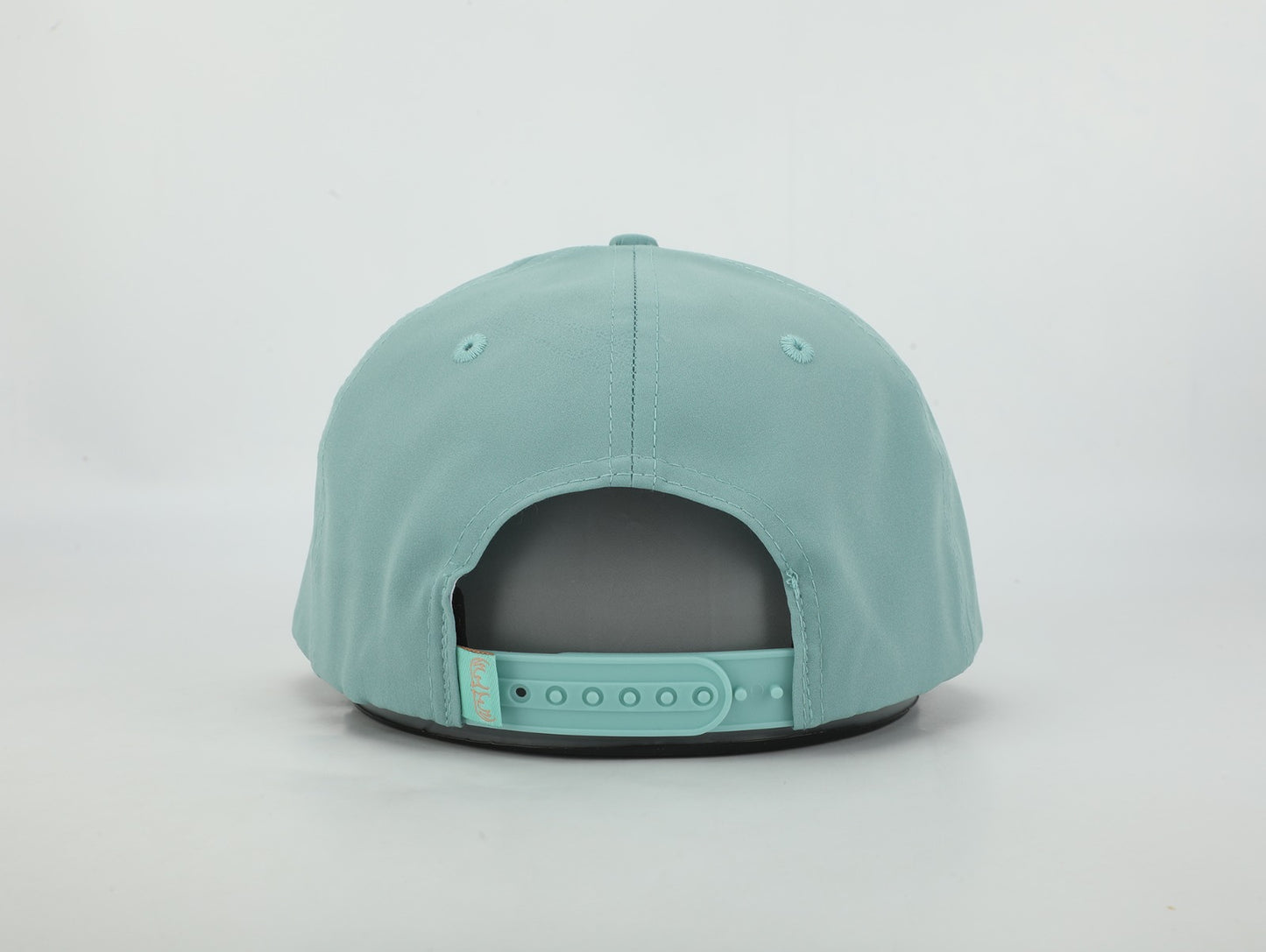 Teal cap on a light gray background